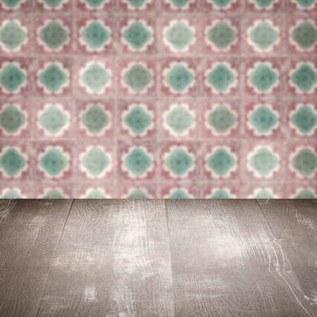 Empty wood table top and blur vintage ceramic tile pattern wall in background, Mock up template for display of your product.の写真素材