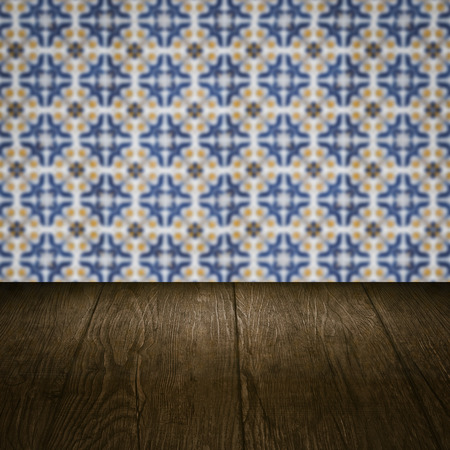 Empty wood table top and blur vintage ceramic tile pattern wall in backgroundの写真素材