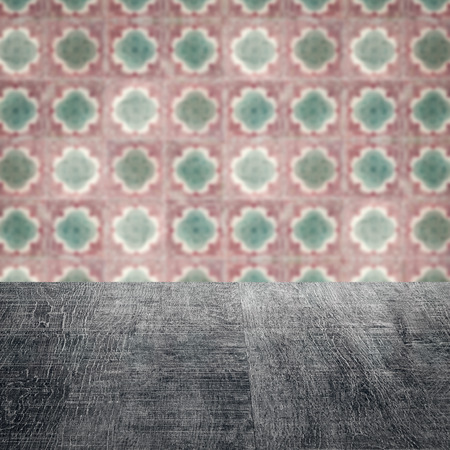 Empty wood table top and blur vintage ceramic tile pattern wall in background, Mock up template for display of your product.の写真素材
