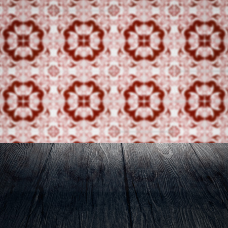 Empty wood table top and blur vintage ceramic tile pattern wall in backgroundの写真素材