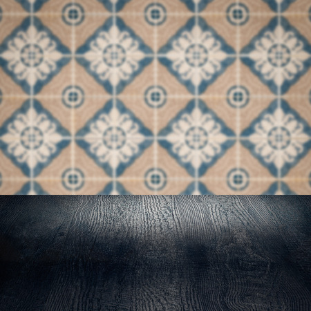 Empty wood table top and blur vintage ceramic tile pattern wall in background, Mock up template for display of your product.の写真素材