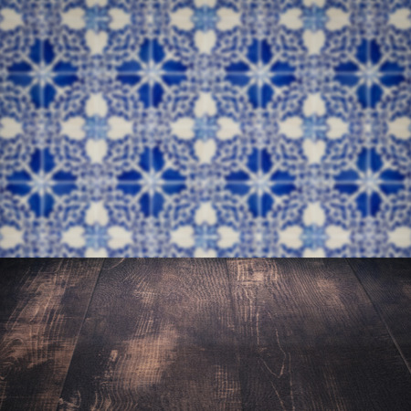 Empty wood table top and blur vintage ceramic tile pattern wall in background, Mock up template for display of your product.の写真素材
