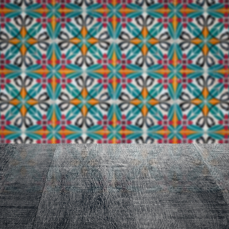 Empty wood table top and blur vintage ceramic tile pattern wall in background, Mock up template for...