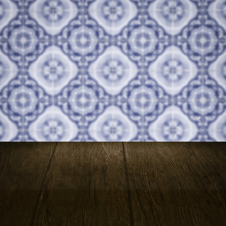Empty wood table top and blur vintage ceramic tile pattern wall in background, Mock up template for display of your product.の写真素材