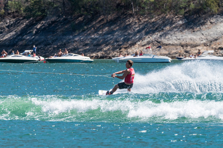 FERREIRA DO ZEZERE, PORTUGAL - SEPTEMBER 19, 2015: Robby Holihan USA during the WWA Supra World Wakeboard Championship 2015 in Ferreira do Zezere, Portugal.のeditorial素材