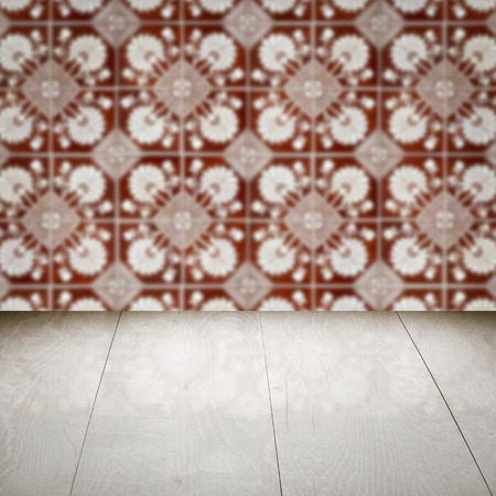 Empty wood table top and blur vintage ceramic tile pattern wall in background, Mock up template for display of your product.の写真素材
