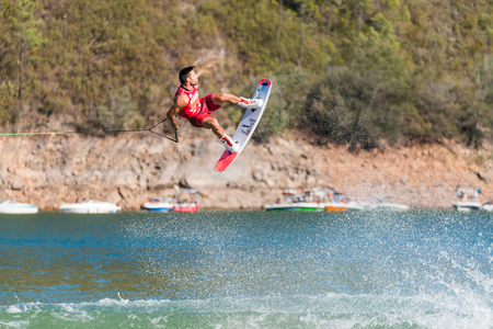FERREIRA DO ZEZERE, PORTUGAL - SEPTEMBER 19, 2015: Tony Carroll (USA) during the WWA Supra World Wakeboard Championship 2015 in Ferreira do Zezere, Portugal.のeditorial素材