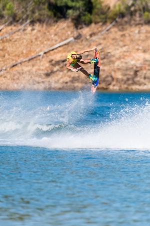 FERREIRA DO ZEZERE, PORTUGAL - SEPTEMBER 19, 2015: Dallas Friday (USA) during the WWA Supra World Wakeboard Championship 2015 in Ferreira do Zezere, Portugal.のeditorial素材
