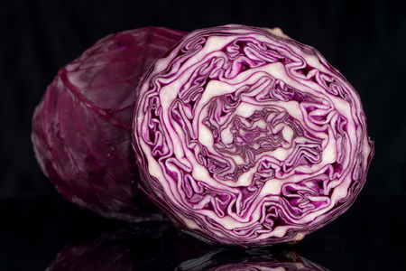 Red cabbage over black background.の写真素材