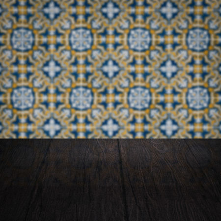 Empty wood table top and blur vintage ceramic tile pattern wall in background, Mock up template for display of your product.の写真素材