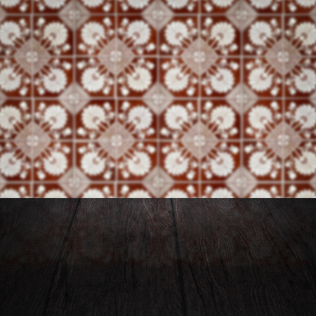Empty wood table top and blur vintage ceramic tile pattern wall in background, Mock up template for display of your product.の写真素材