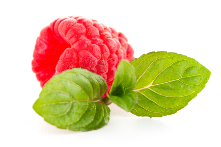 Raspberries with leaves isolated on white backgroundの写真素材