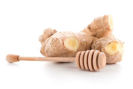 Ginger root and drizzler isolated on white background.の写真素材