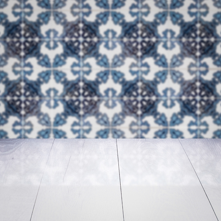 Empty wood table top and blur vintage ceramic tile pattern wall in backgroundの写真素材