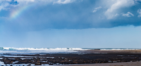 Sea beach in Ericeira for surfers. Portugal winter clouds over the Atlantic ocean.の写真素材