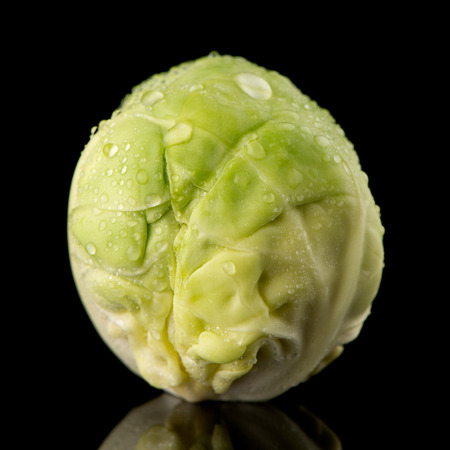 Fresh brussels sprouts isolated on black background.の写真素材