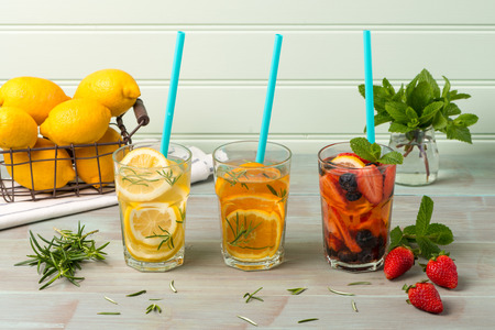 Detox water cocktails on wooden table.の写真素材