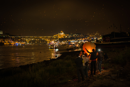 PORTO, PORTUGAL - JUNE 24, 2016: Baloon launch during the Festival of St John of Porto. One of Europe's liveliest street festivals.のeditorial素材