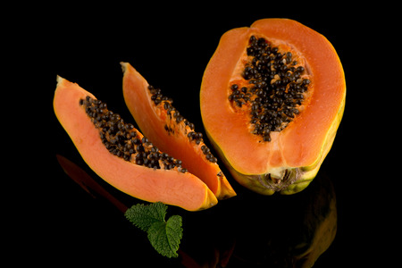 Fresh and tasty papaya on black background.の写真素材