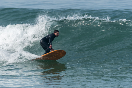 Surfer in action on the ocean waves on a sunny day.の写真素材