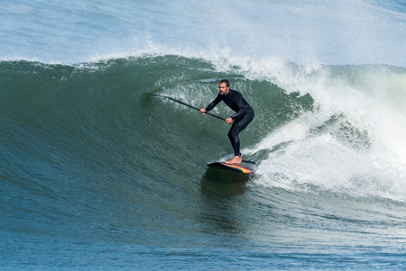 Stand up paddle surfer on the atlantic ocean.の写真素材