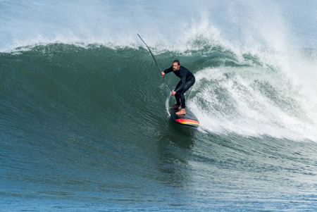 Stand up paddle surfer on the atlantic ocean.の写真素材