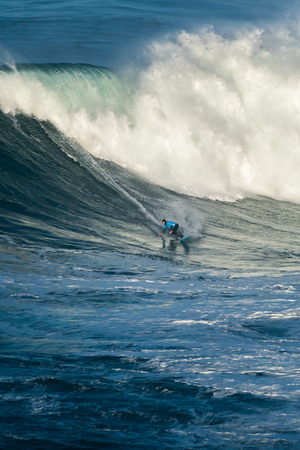 NAZARE, PORTUGAL - DECEMBER 20, 2016: Grant Baker (ZAF) during the Nazare Challenge 2016 - Big Wave Tour #3 at Praia do Norte - Nazare, Portugal.のeditorial素材