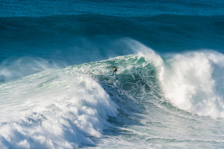 NAZARE, PORTUGAL - DECEMBER 20, 2016: Grant Baker (ZAF) during the Nazare Challenge 2016 - Big Wave...
