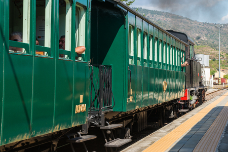 TUA, PORTUGAL - JULY 08, 2017: Historic train on Tua's Train Station. The train runs between June and October along the bank of the river Douro.のeditorial素材