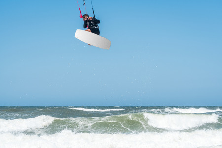 Kiteboarder enjoy surfing on a sunny day.の写真素材