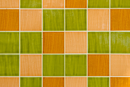 Green and yellow square tiles with white filling.