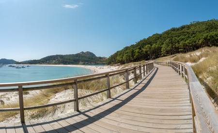 ISLAS CIES, SPAIN - CIRCA SEPTEMBER 2017: Wooden courseway along the sand beach of Playa de Rodas on the Cies Islands of Spain, included in the Atlantic Islands of Galicia National Park.のeditorial素材