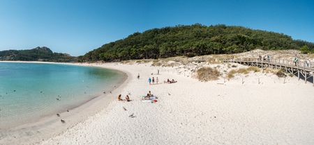 ISLAS CIES, SPAIN - CIRCA SEPTEMBER 2017: Unidentified people relax on the sand beach of Playa de Rodas on the Cies Islands of Spain, included in the Atlantic Islands of Galicia National Park.のeditorial素材