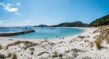 ISLAS CIES, SPAIN - CIRCA SEPTEMBER 2017: Unidentified people relax on the sand beach of Playa de Rodas on the Cies Islands of Spain, included in the Atlantic Islands of Galicia National Park.のeditorial素材