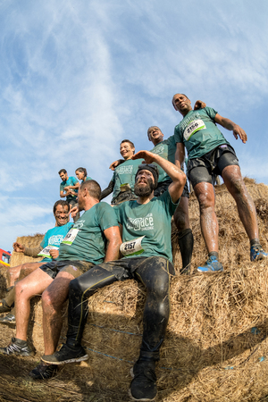 ESTARREJA, PORTUGAL - SEPTEMBER 23: Athletes overcoming the hay osbtacle at the Biorace on september 23, 2017 in Estarreja, Portugal.のeditorial素材
