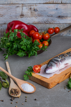 Fresh fish sea bass on wooden table.の写真素材