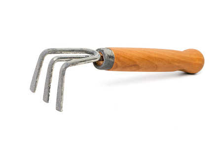 Small gardening fork isolated on white. Studio shot.の写真素材
