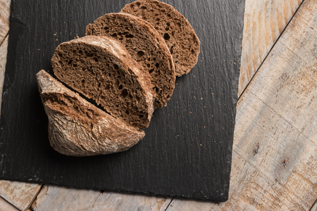 Malt loaf bread slices on table.