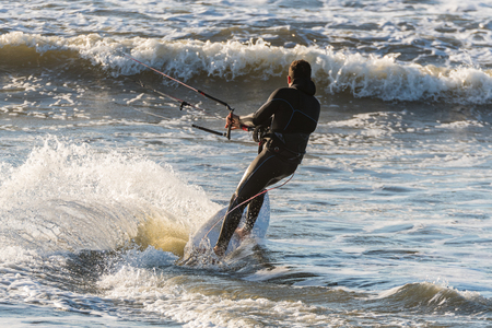 Kiteboarder enjoy surfing on a sunny day.の写真素材