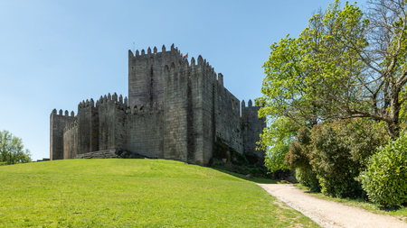 GUIMARAES, PORTUGAL - CIRCA APRIL 2018: The Castle of Guimaraes in the northern region of Portugal. It was built at the end of the 13th century following French influences.のeditorial素材