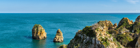Cliffs view by Atlantic Ocean, Lagos, Algarve, Portugal.の写真素材