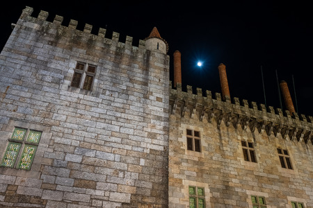 GUIMARAES, PORTUGAL - CIRCA APRIL 2018: Night view of Palace of the Duques of Braganca, Guimaraes,...