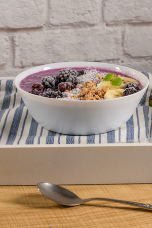 Blueberry smoothie with banana, cococnut and blackberries.の写真素材