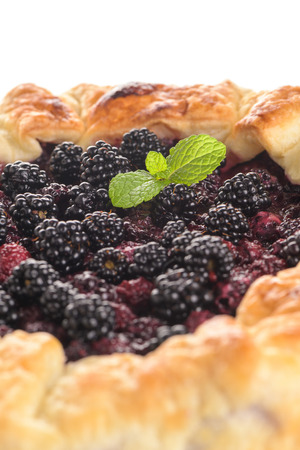 Homemade pie closeup on blackberries.の写真素材