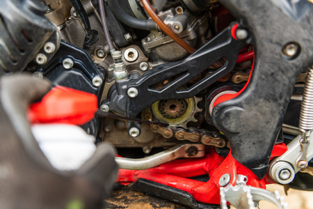 Lubricating motorcycle chain with dedicated chain spray grease.のeditorial素材