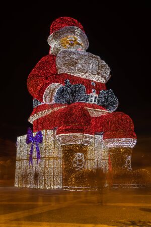 AGUEDA, PORTUGAL - CIRCA DECEMBER 2018: Worlds biggest Santa Claus with 21 meters hight, iluminated by 250. 000 Christmas lights.のeditorial素材