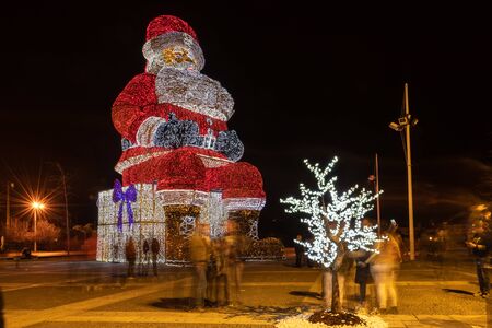AGUEDA, PORTUGAL - CIRCA DECEMBER 2018: Worlds biggest Santa Claus with 21 meters hight, iluminated by 250. 000 Christmas lights.のeditorial素材