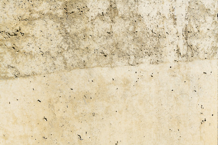 Rusty stone concrete surface in tan color, detailed natural texture.