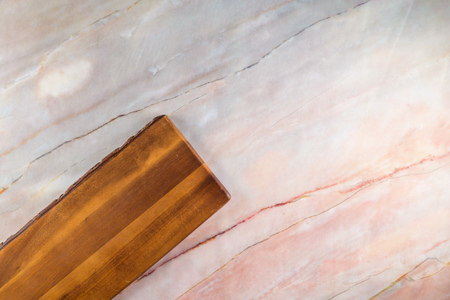 Top view of wooden cutting board on a gray marble background with space for text.の写真素材