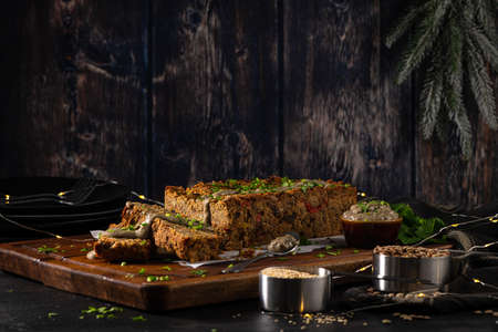 Christmas lentils loaf on dark kitchen countertop.の写真素材